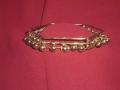 Antique dull-gold colored metal armlet with little bells. Can also be worn as a bracelet. The armlet / bracelet is adjustable. Circumference is 9 inches.