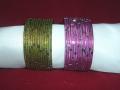 Set of 12 colored Indian metal bangles with golden markings on them.   Diameter is 5.5 cms (aka 2/4 inches).  Available in pink and green colors.