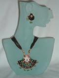 Beautiful handmade Rajasthani minakari necklace & earrings set.  The necklace consists of an exquisite minakari pendant on an adjustable bead necklace.  The pendant has a traditional Rajasthani motif hand-painted on it.  The stud earrings have a matching design hand-painted on them.  The length of the necklace is adjustable.