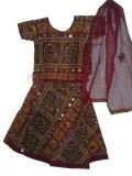 Brown, bandhani-print lacha/chaniya choli in cotton.  Both the choli and the skirt have embroidery on them, and are embellished with mirrors and sequins.  The skirt has a maroon trim at its base;  similarly, the top has a maroon trim at its base and sleeve cuffs.  The dupatta/scarf is cotton and maroon in color with a brown bandhani trim.  The skirt has a drawstring waistband.  The top is open in the back, with ties. 
<br>
Sizes available for girls aged 1 year and up.