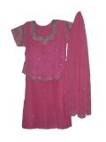 Pink georgette lehenga choli for kids. The long, kurti-style top has ties in the back for a fitted look. Heavy work using thread embroidery golden zari around the neck, sleeves and base of the kurti. Bootis using golden zari on the skirt; golden zari dots on the dupatta. The skirt is flared and has a drawstring waist. Sizes available for girls 1 year old and up.