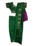 Beautiful green silk ready-to-wear Indian sari for kids.  The readymade sari set consists of a blouse, petticoat and sari.  The sari is attached to the petticoat, and the pleats are pre-made.  The skirt part  of the saree is green with a gold border at the base.  All you need to do to wear this sari is to slip it on like a skirt, and then arrange the "pallu" the way you want to;  a sari in minutes!!  The blouse is green silk with bead bootis all over.  It has a gold border at the sleeves and at the base, and is embellished with beads and sequins.  The blouse is short - it leaves the midriff exposed.  The skirt part of the sari has a drawstring waistband and the front is covered with sequin bootis. Sizes available for children aged 1 year and up.
